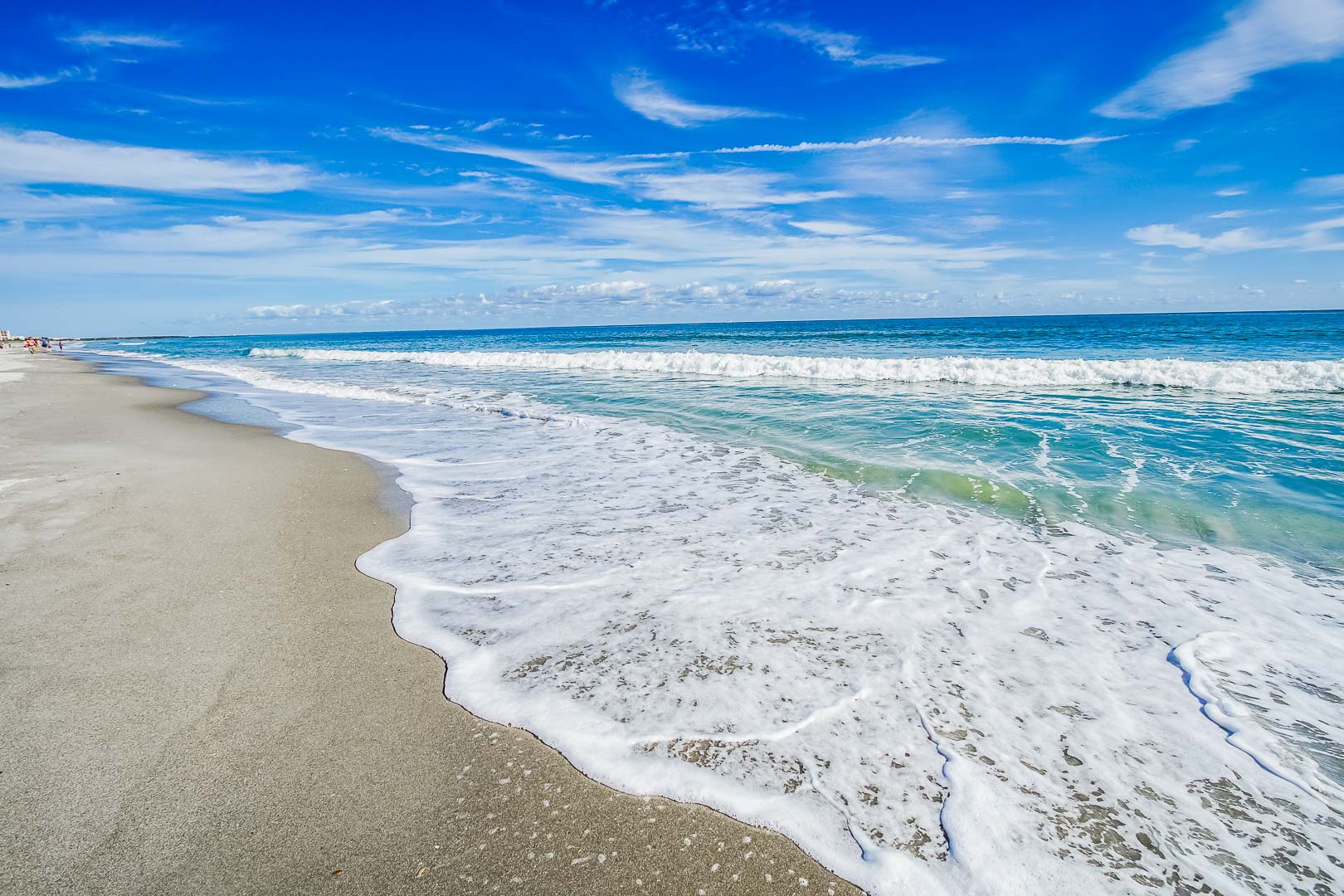 A relaxing view of the beach at VRI's Discovery Beach Resort in Cocoa Beach, Florida.